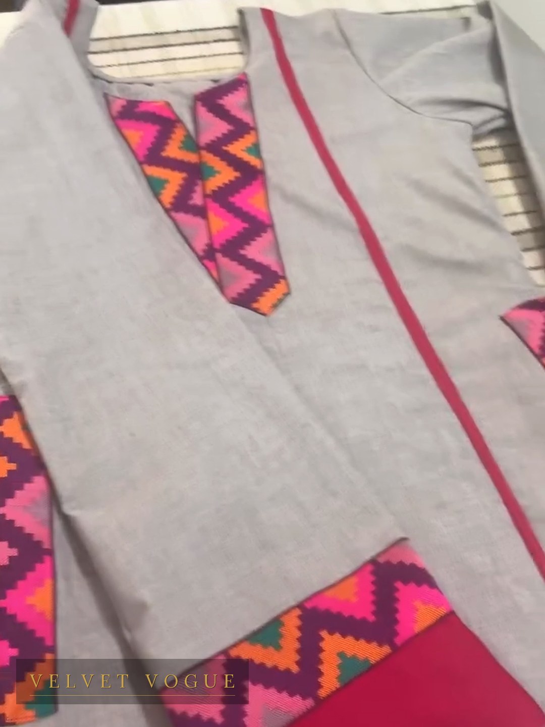 The zigzag placket and hem band matched to each other on natural grey handloom.