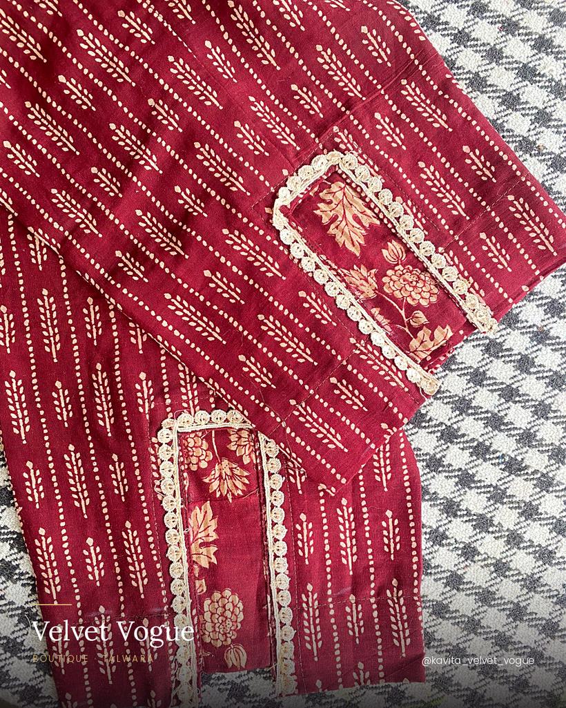 Maroon bandhani with a contrast floral placket, edged in cream lace.