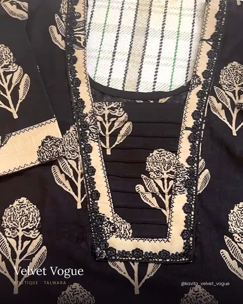 A block-print V-neck with a pintuck panel and scalloped binding.